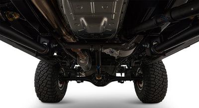 Undercarriage view showing suspension, exhaust, and tires of a Classic Ford Bronco