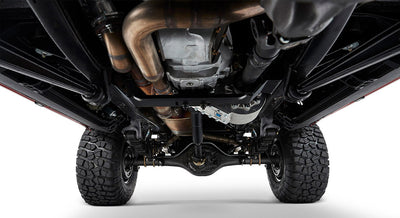 Undercarriage view showing suspension components and tires of a Classic Ford Bronco