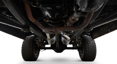 Undercarriage view of Classic Ford Bronco showing frame, exhaust, and rear wheels