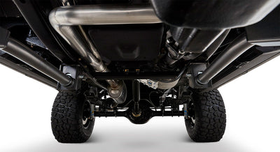 Undercarriage of a Classic Ford Bronco showing rear tires, axle, exhaust, and suspension components