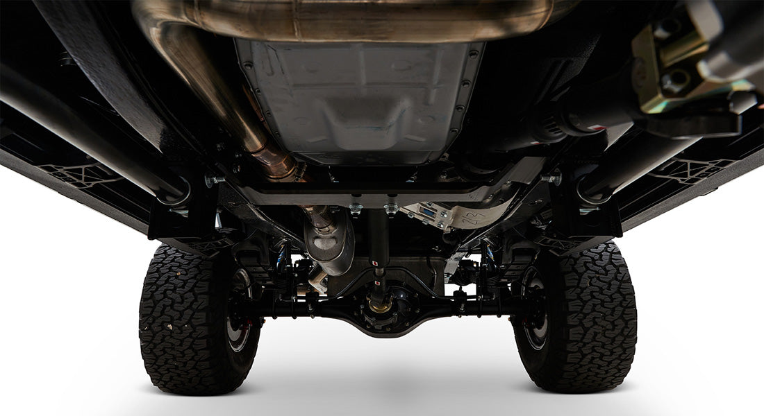 Undercarriage view showing tires, differential, and exhaust system of Classic Ford Bronco