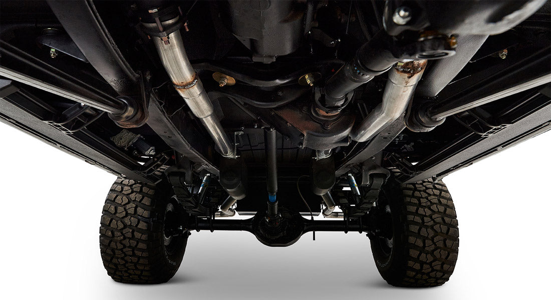 Undercarriage view of Classic Ford Bronco showing suspension, axle, and tires