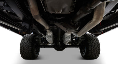 Clean undercarriage of a Classic Ford Bronco showing dual exhausts and suspension system