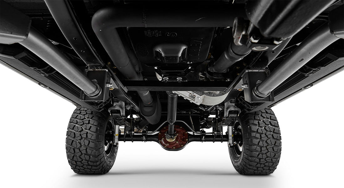Undercarriage front view of Classic Ford Bronco showing differential, frame, and large off-road tires