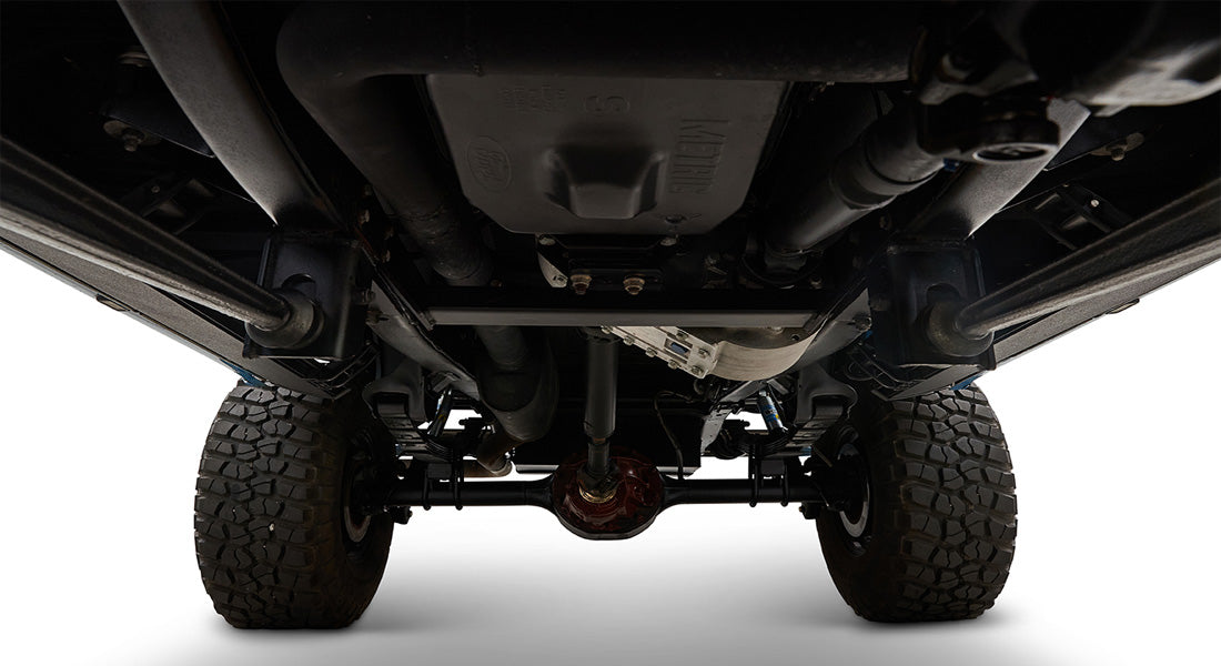 Undercarriage view of Classic Ford Bronco showing differential, suspension, and tires