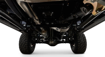 Undercarriage view of a Classic Ford Bronco showing suspension and tires.
