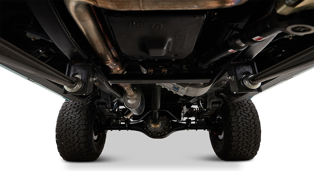 Undercarriage of Classic Ford Bronco showing exhaust and drivetrain components