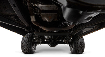 Undercarriage view of Classic Ford Bronco highlighting exhaust pipes and suspension