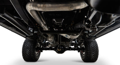 Undercarriage of Classic Ford Bronco showing exhaust pipes and suspension components