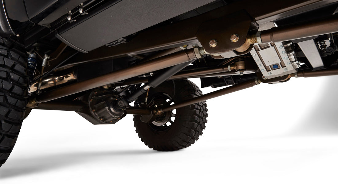 Close-up view of rear suspension, axle and drive components under Classic Ford Bronco