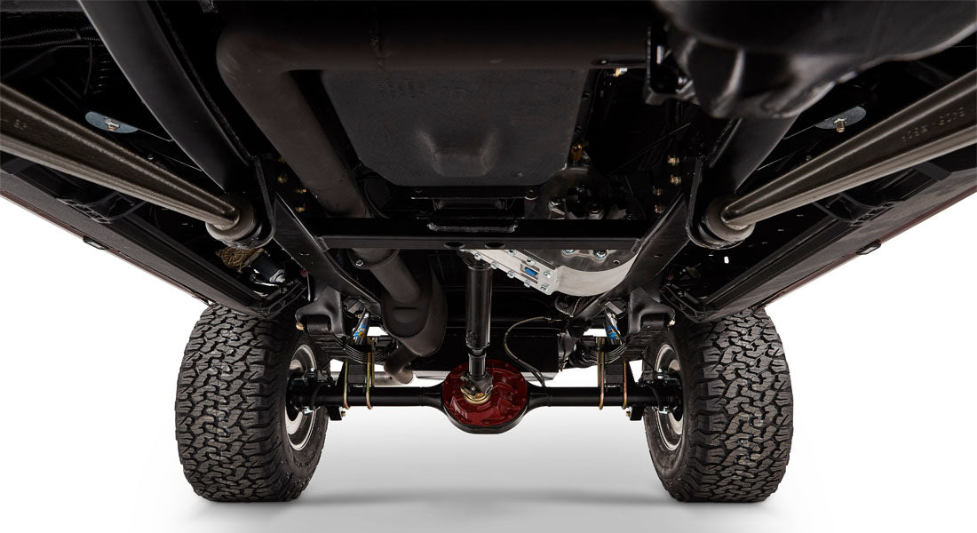 Undercarriage view of Classic Ford Bronco showing exhaust, suspension, and differential