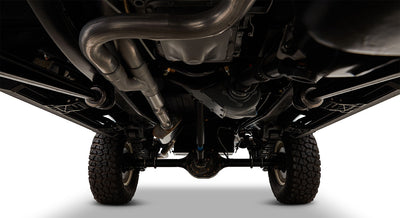 Undercarriage view showing exhaust pipes, differential, and tire treads
