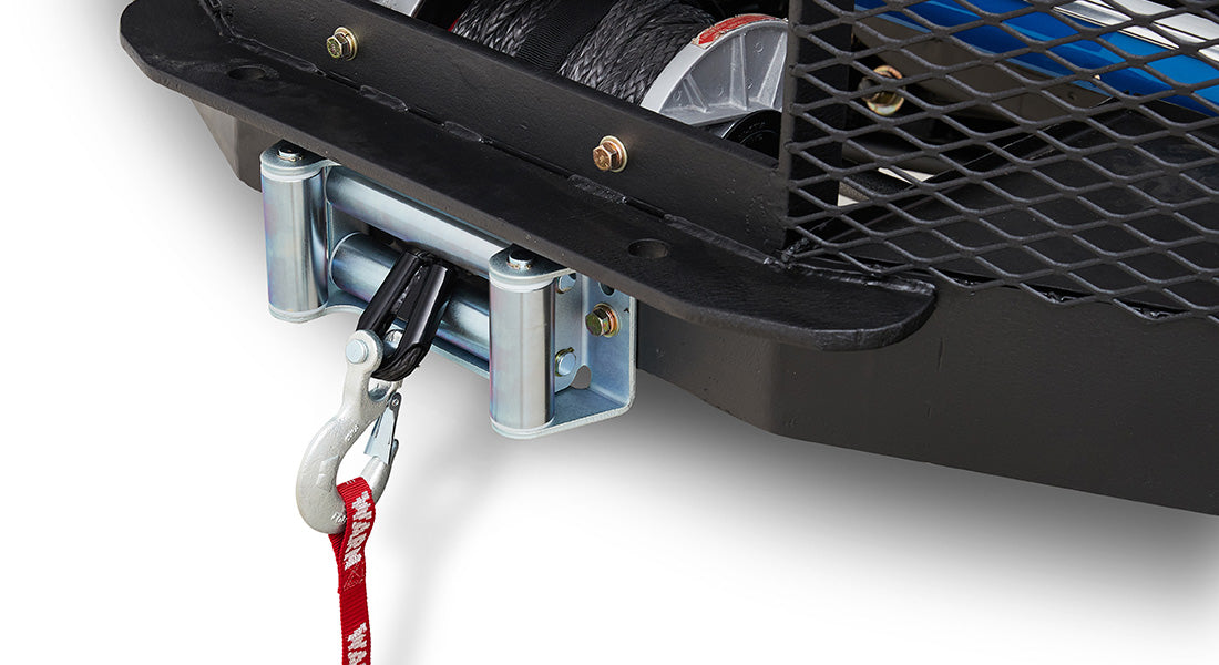 Winch with hook and red strap mounted on black front bumper of Classic Ford Bronco