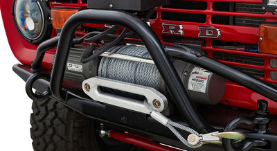 Front of a red Classic Ford Bronco with a winch mounted on the bumper